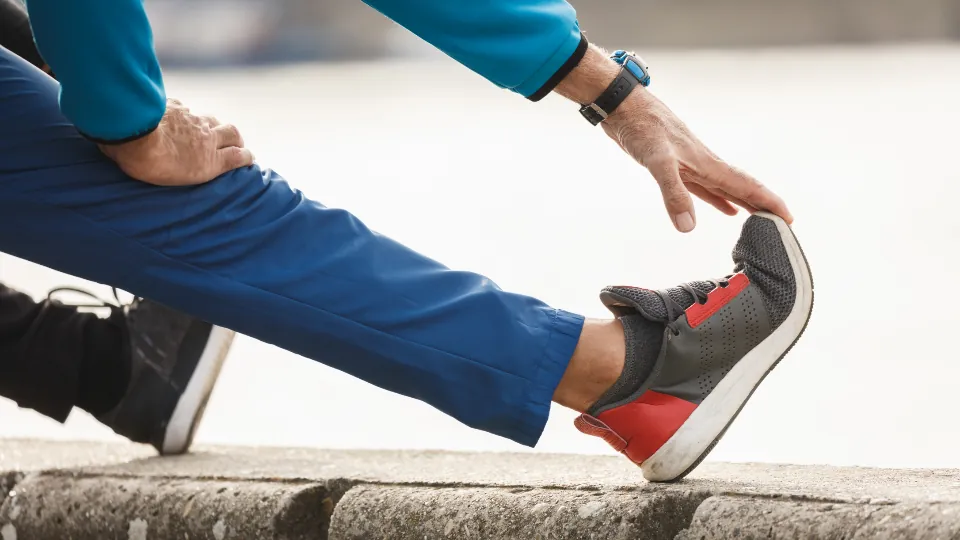 Person stretching their leg before exercise
