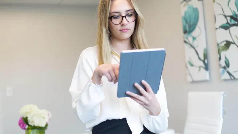 Woman reading health guides on a tablet at home