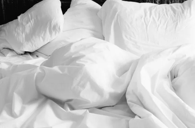 Soft white bed sheets for restful sleep and recovery